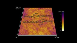 使用 <b>BudgetSensors Tap300Al-G</b> AFM 探针和 Asylum MFP 3D AFM 系统在火焰退火聚碳酸酯表面上通过划痕光刻印制 BudgetSensors 徽标